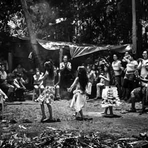Young girls dance at a memorial gathering…